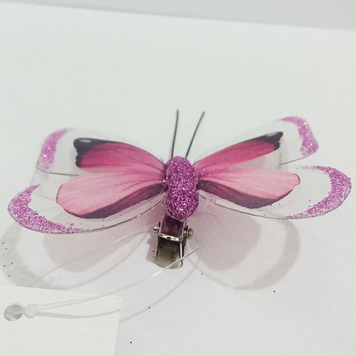 Mariposa rosa con pinza