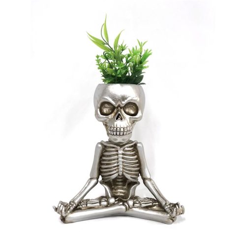 Maceta calavera haciendo yoga