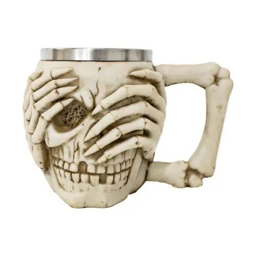 Taza de acero inoxidable diseño cráneo con manos en ojos y asa de hueso