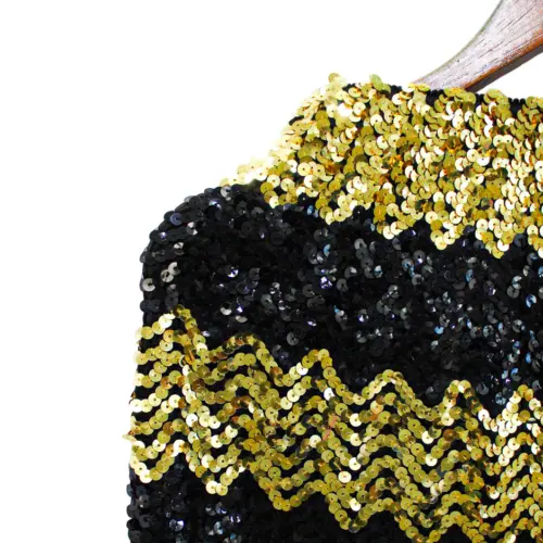 Falda de lentejuelas dorada con negro de 28x33x0.1cm