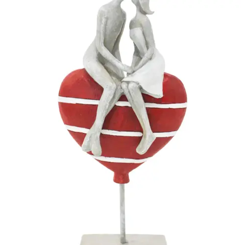 Pareja sobre corazón de poliresina de 14x7x30.5cm