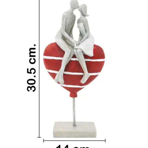 Pareja sobre corazón de poliresina de 14x7x30.5cm