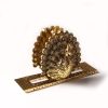 Servilletero dorado diseño pavorreal - Galerías el Triunfo - 156072692058