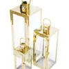 Juego de 3 candelabros de metal dorados de 18x18x49cm - Image 2